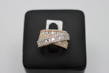 Tri-Color Cocktail Ring in 18K white, yellow and rose gold, with crossing rows of baguette and round natural diamonds on a black display.