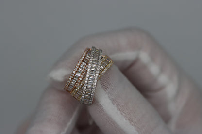 Angled close-up of the Tri-Color Cocktail Ring held in a white glove, showing baguette diamonds bordered by round diamonds.