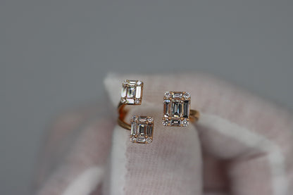Close-up of the Past, Present, & Future Ring held in a white glove, showing three rectangular diamond clusters on an open rose gold design.