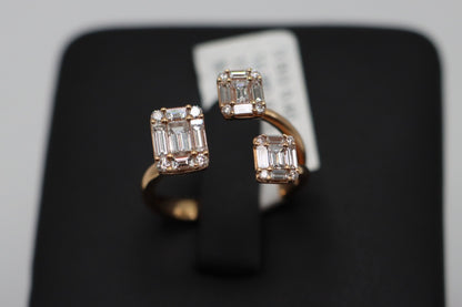 Past, Present, & Future Ring in 18K rose gold on a black display, with three rectangular clusters of baguette and round natural diamonds.