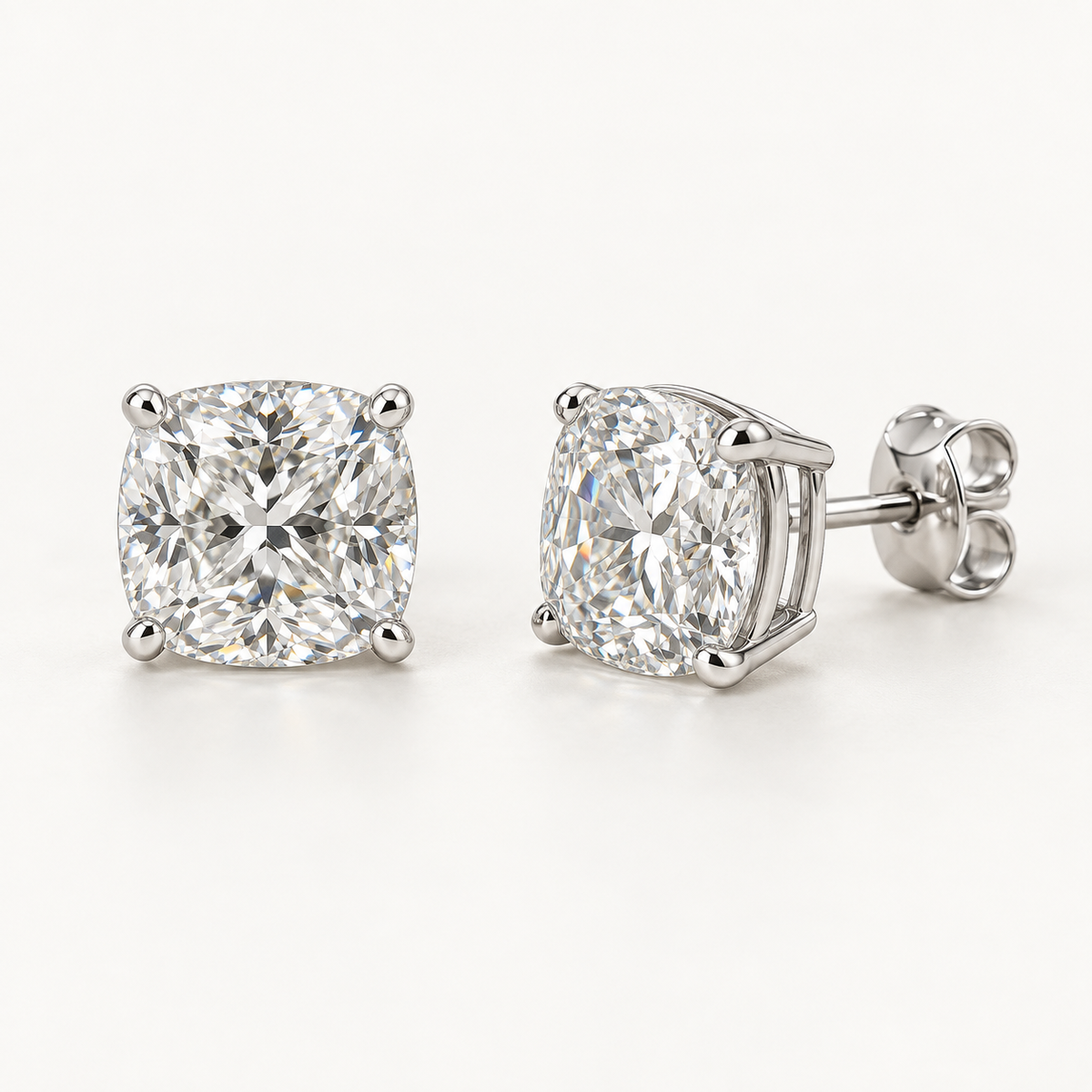 Adrienne Diamond Studs, 2 Carats Total, 14K White Gold, cushion diamonds in four-prong basket settings — AI design rendering.