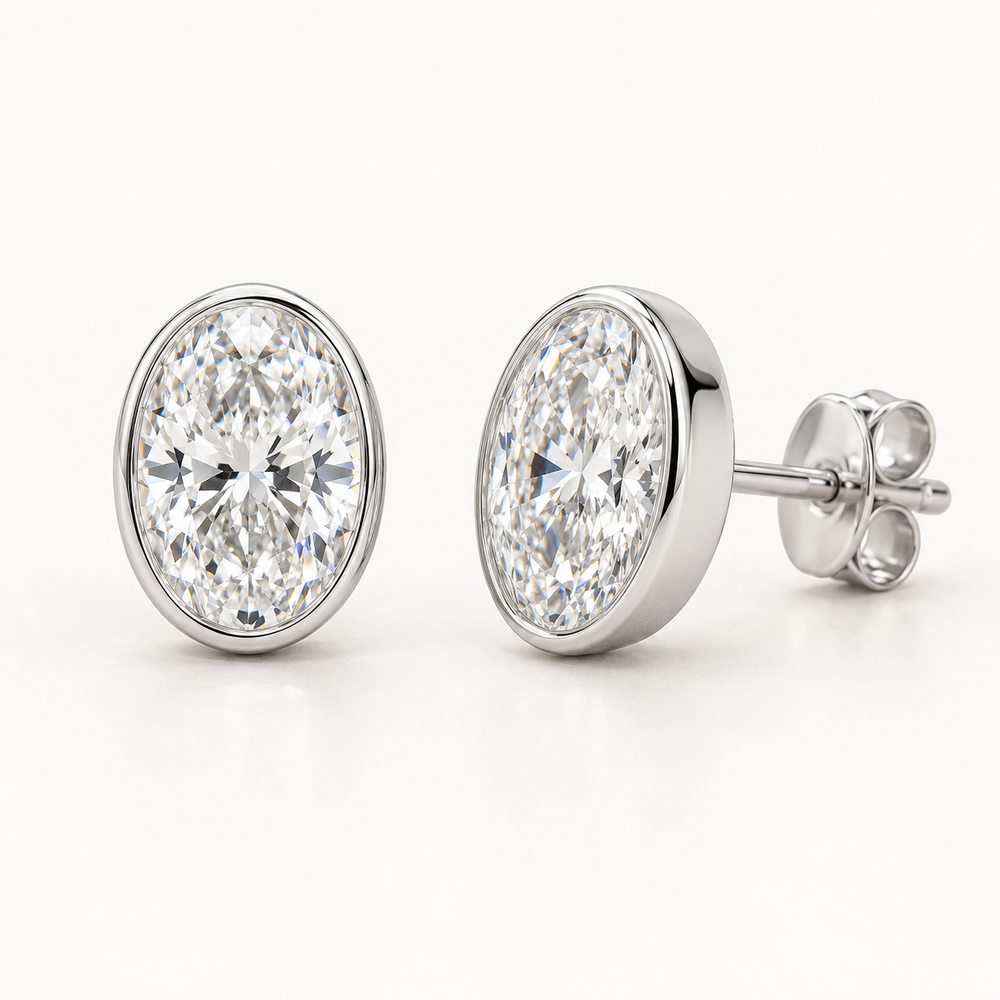 Lunelle Diamond Studs, 2 Carats Total, 14K White Gold, oval diamonds in bezel settings — AI design rendering.
