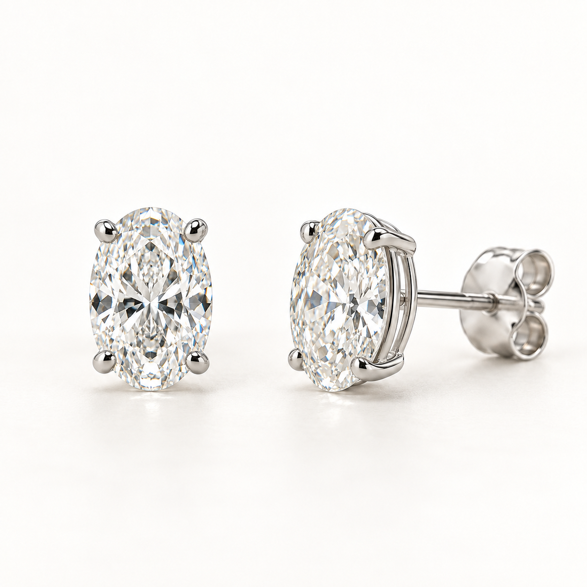 Ovelle Diamond Studs — 1 Ctw Pair, 14K White Gold, Oval Basket Setting — AI Design Rendering